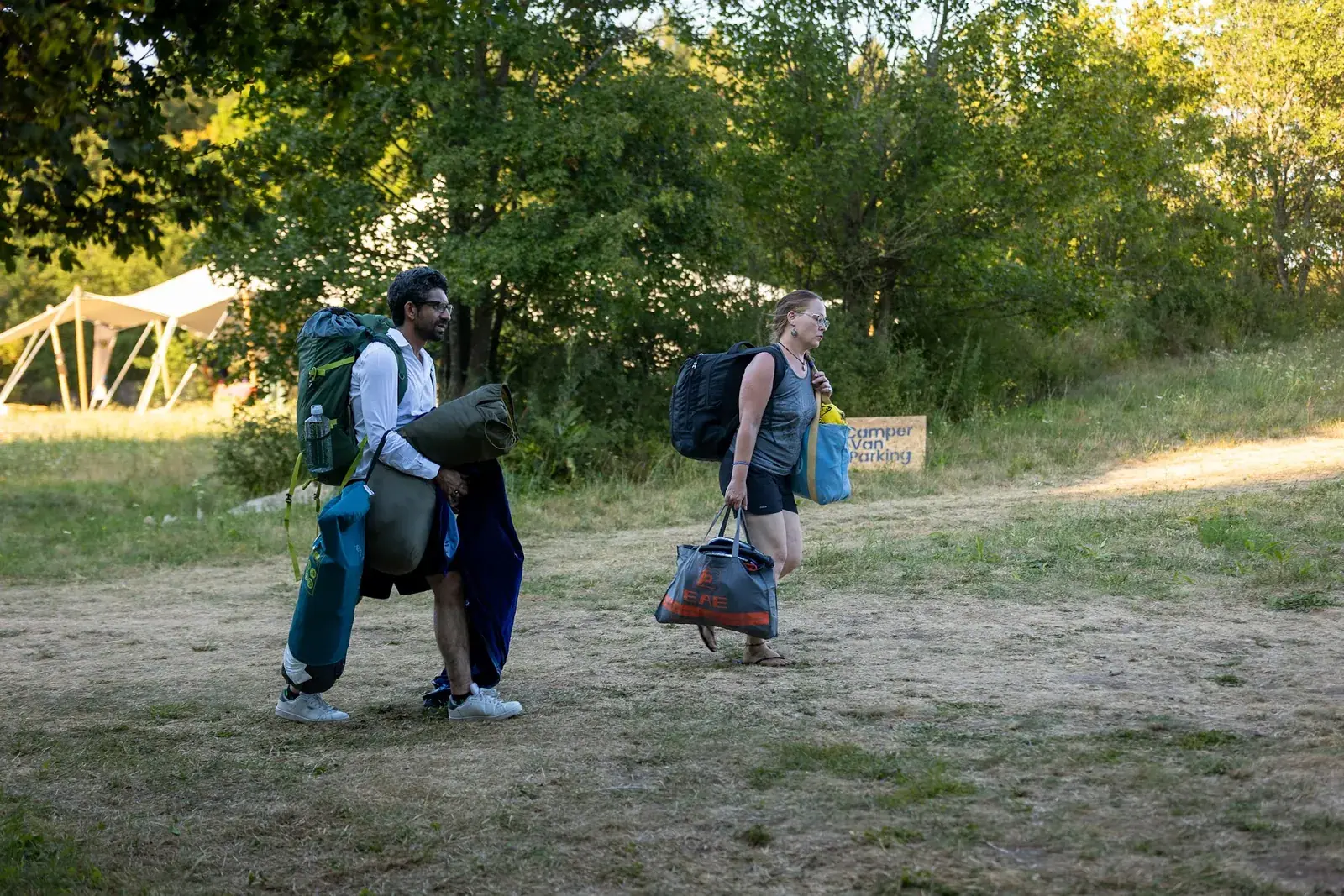 Guests arriving with backpacks and mats