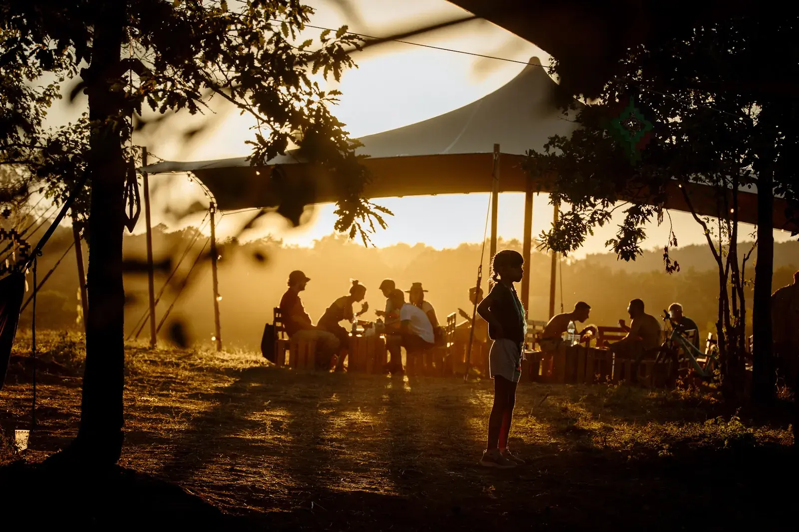 People in the village in the golden light before sunset