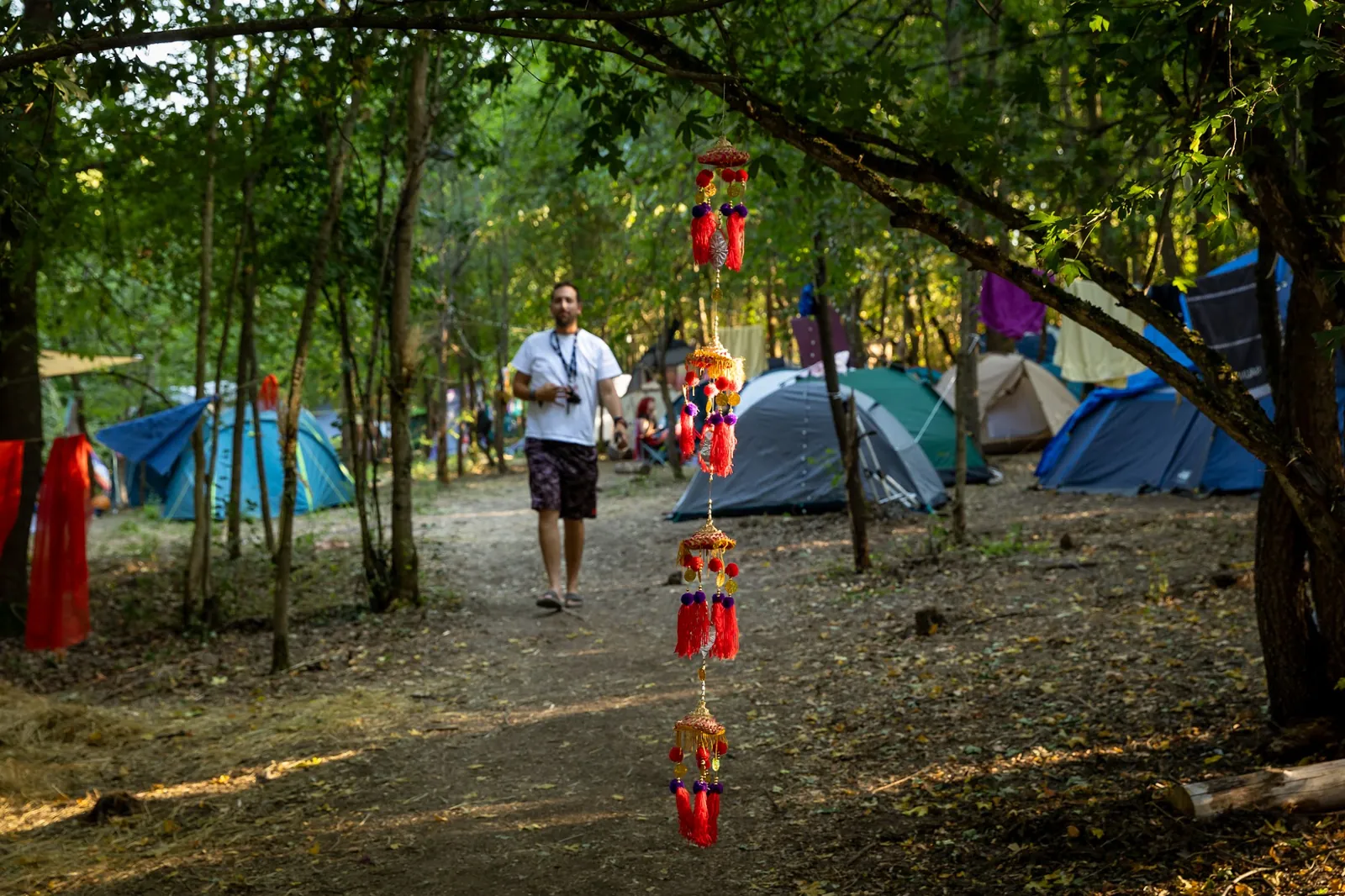Handmade decorations hanging over a camp path